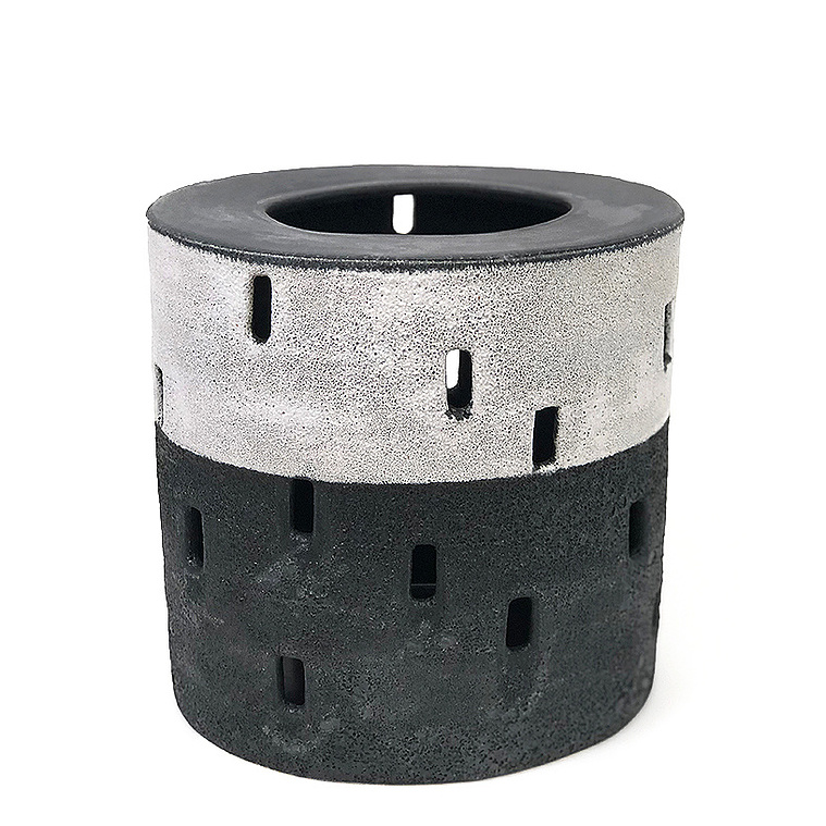The Half Night, Tulou Vessel is an oval ceramic black and white sculpture hand-built in strips by artist Kathy Erteman. The fortress-like exterior with its pierced window cutouts was inspired by Tulou architecture