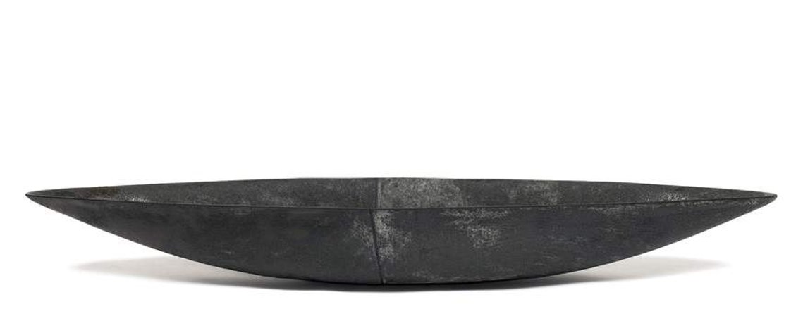 Hudson Valley-based artist Kathy Erteman hand-built the Two-Tone Gray Boat from stoneware. Slab-built with a half blue gray and half soot gray glaze, the minimal form of this ceramic vessel is strengthened by the subtle color shift and black dividing line
