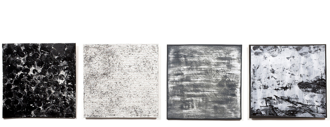 Asphalt and Snow, porcelain tablets, is an installation by artist Kathy Erteman. It’s made of porcelain slabs to which she applied differing tones of black and white textured glazes. A custom design, the ceramic wall art creates a unified whole