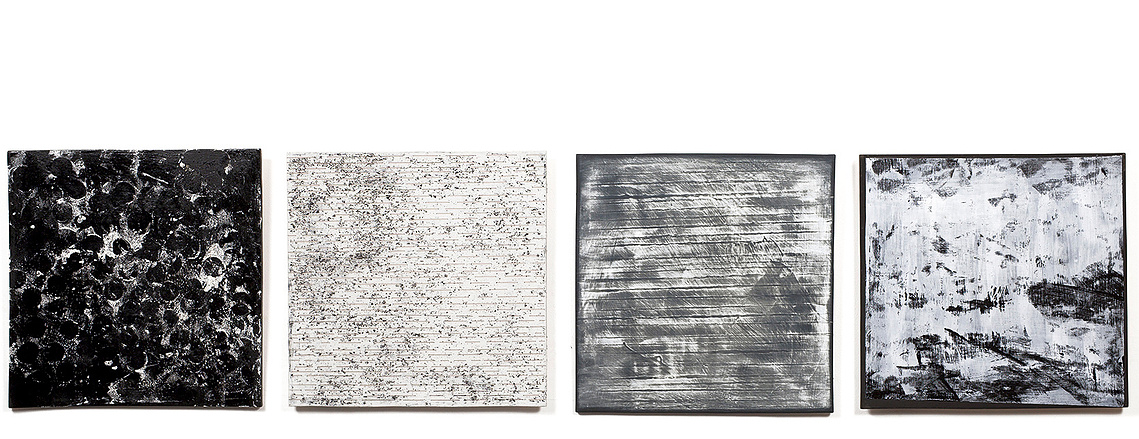 Asphalt and Snow, porcelain tablets, is an installation by artist Kathy Erteman. It’s made of porcelain slabs to which she applied differing tones of black and white textured glazes. A custom design, the ceramic wall art creates a unified whole