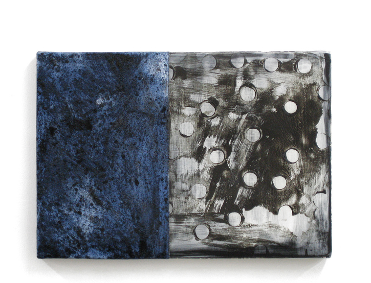 This ceramic wall piece with a cobalt textured glaze and black and white monoprint is by artist Kathy Erteman. Titled Blue Monoprint Tablet, the clay monotype is designed to be an architectural wall sculpture.