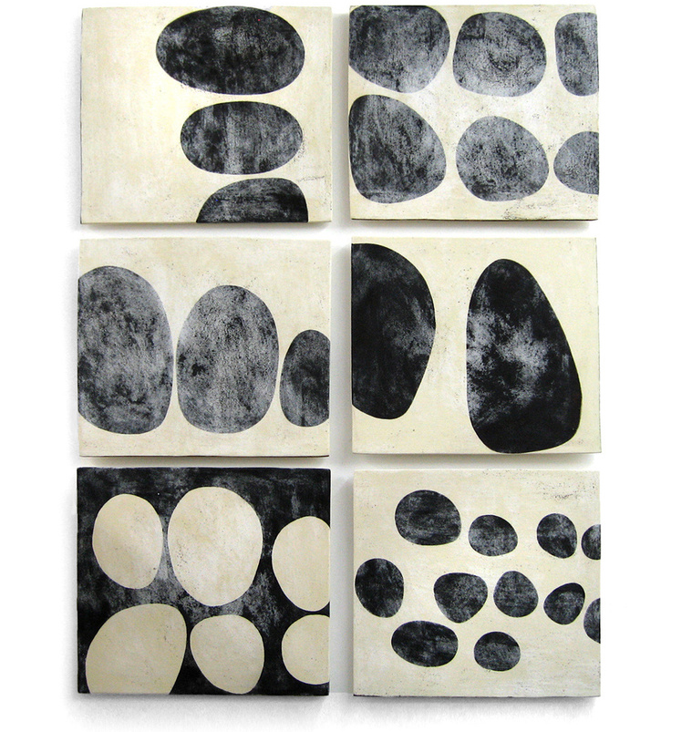 Tumble 6 is a ceramic installation by artist Kathy Erteman that incorporates six porcelain slabs. The black, which is painted, has a white textured glaze as a contrast to give this handmade custom ceramic wall art a graphic element 