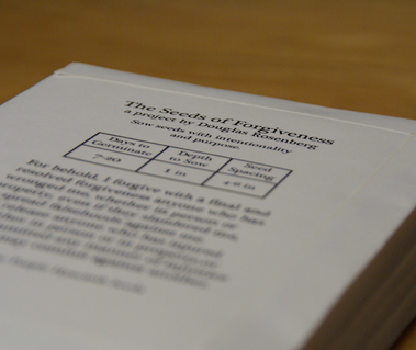 photographs from douglas rosenberg's relational performance art work forgiveness, showing the design on the back of the white envelopes labeled forgiveness