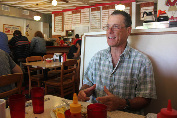 photograph of douglas rosenberg's relational performance at mickey's dairy bar in madison wisconsin, featuring the artist