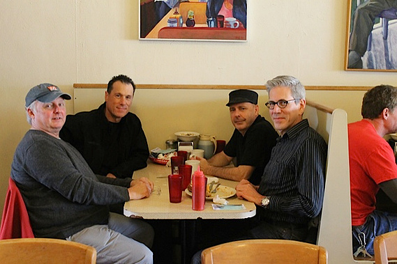 photograph of douglas rosenberg's relational performance at mickey's dairy bar in madison wisconsin, featuring the artist with performance participants