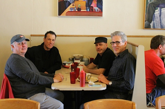 photograph of douglas rosenberg's relational performance at mickey's dairy bar in madison wisconsin, featuring the artist with performance participants