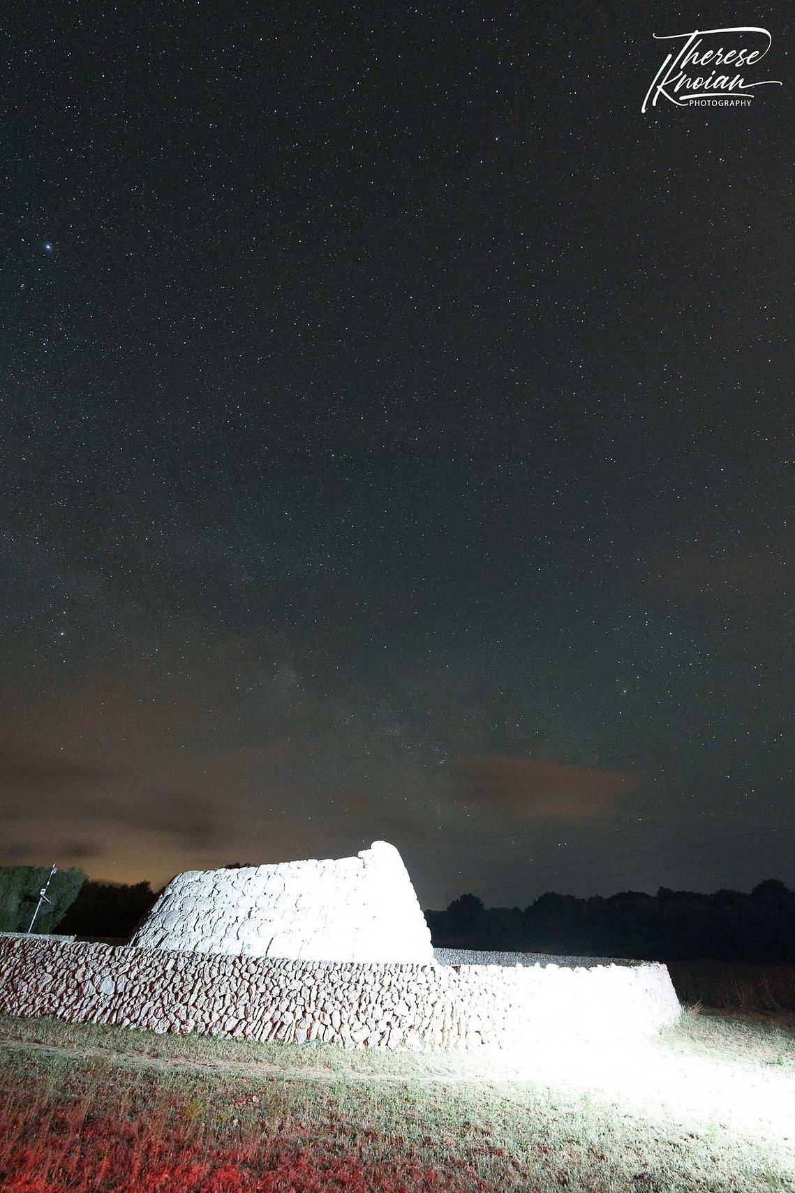 A photograph in Menorca, Spain, showing how a single headlamp can blow out a photo taken at night. 