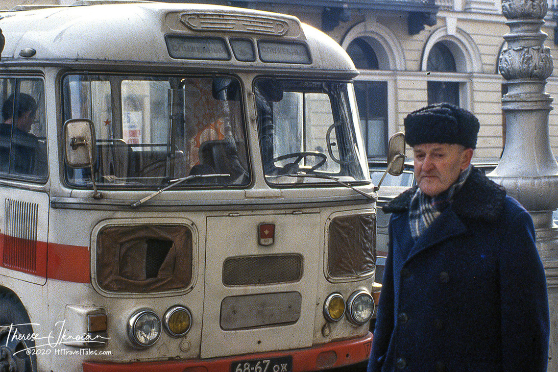 A man standing in front of a bus in what was known as Leningrad in 1984, now St. Petersburg. 