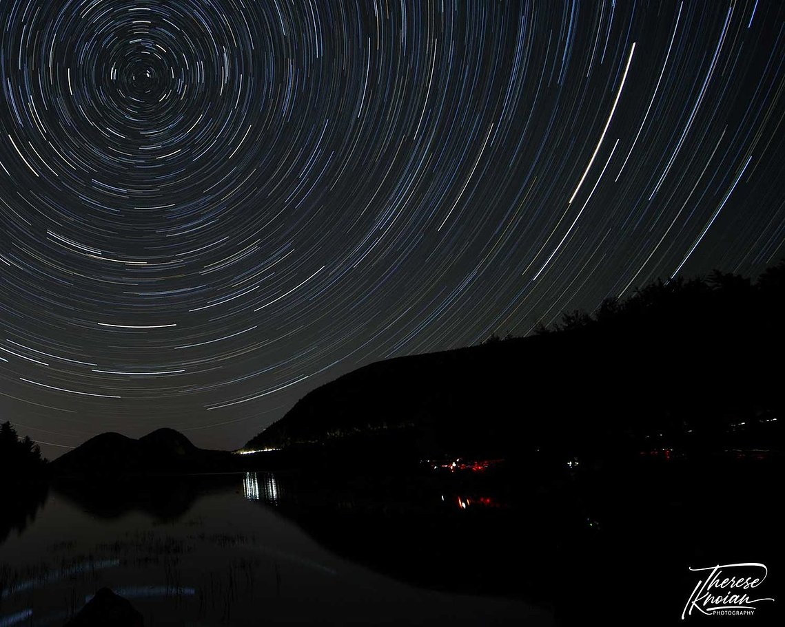 Star circles over Jordan Pond in Acadia National Park with light pollution from other photographers who forgot to turn off their lights. 