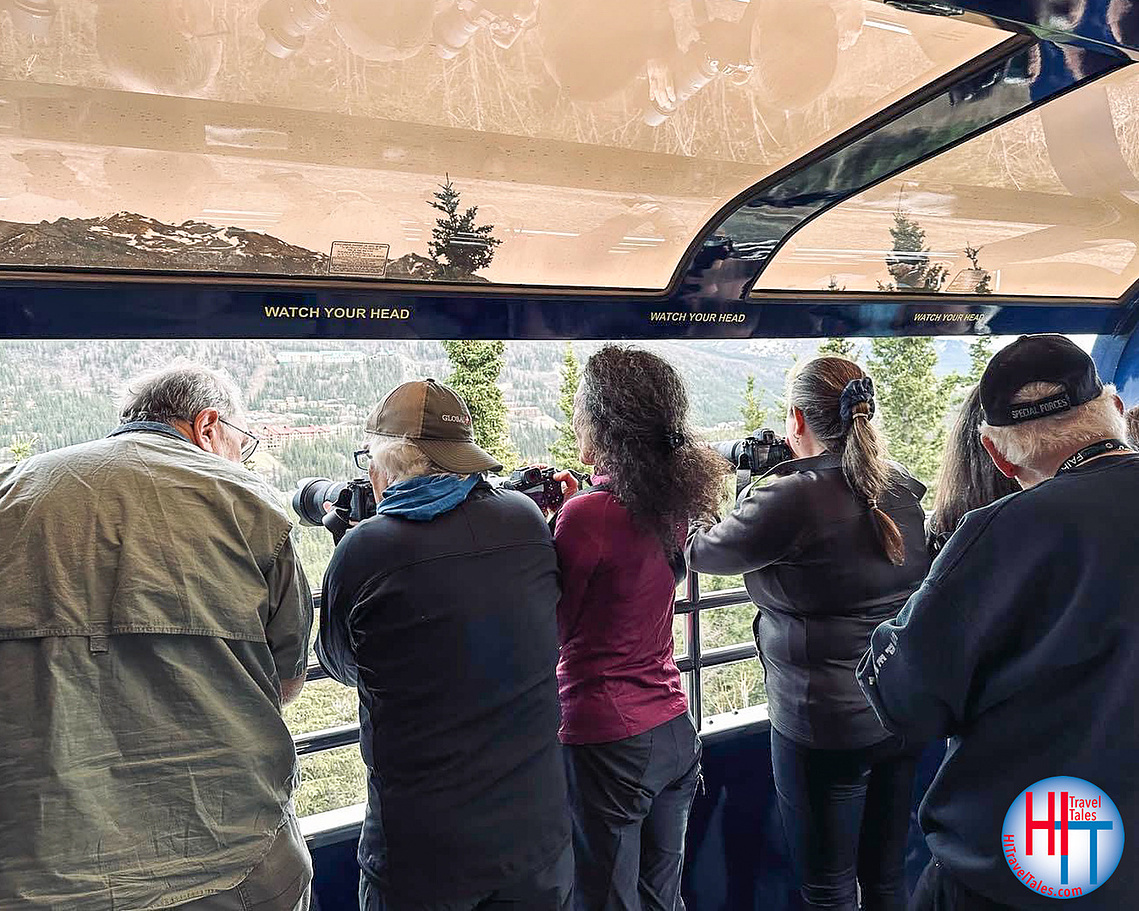 The author, Michael Hodgson, and fellow photographer and wife, Therese Iknoian, sharing the platform with other photographers on an Alaska Railroad Denali Star train. 