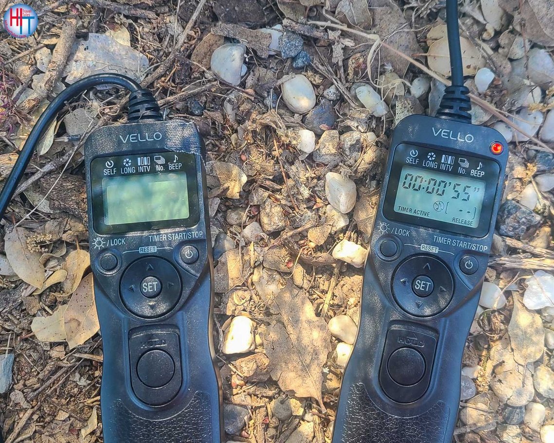 Vello intervalometers with black gaffers tape over red light that glows. 