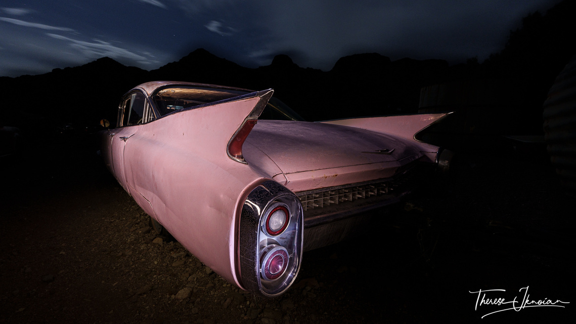 A pink cadillac gets an eerie glow after being light painted in this night photo. 