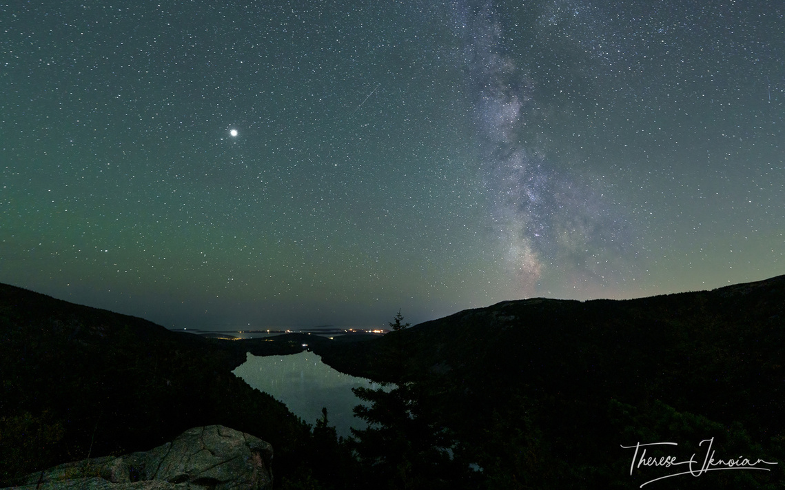 Milky Way floating in the distance over Jordan Pond in Acadia National Park in Maine. 