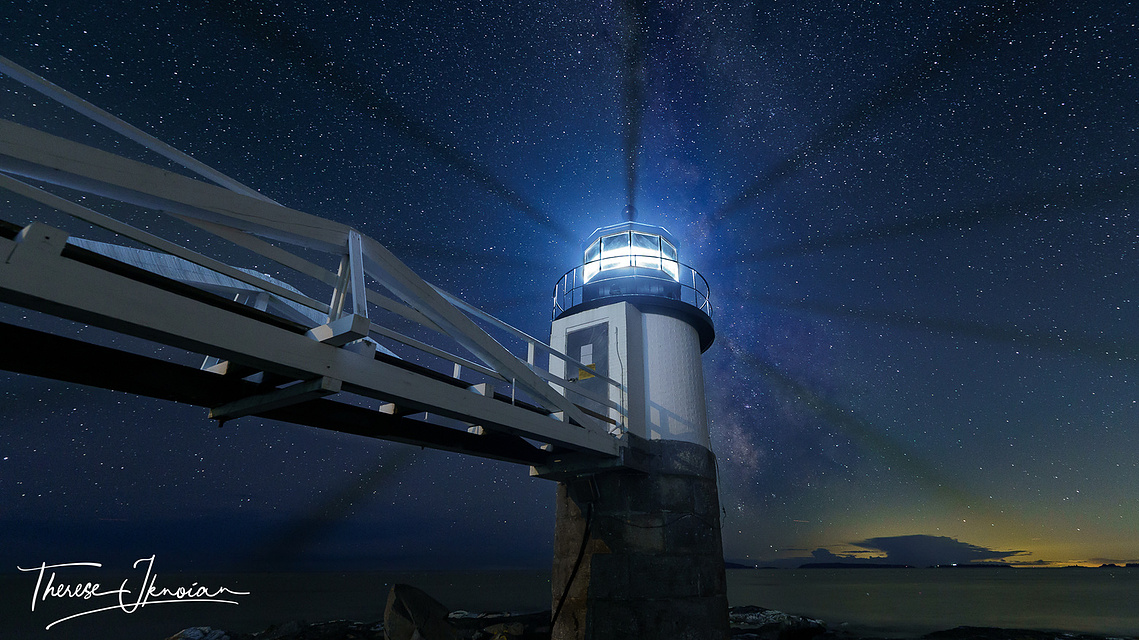 Marshall Point lighthouse  and Milky Way with light creating a pinwheel