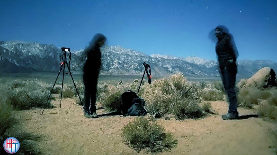 Two photographers at Alabama Hills taking photos at night. 