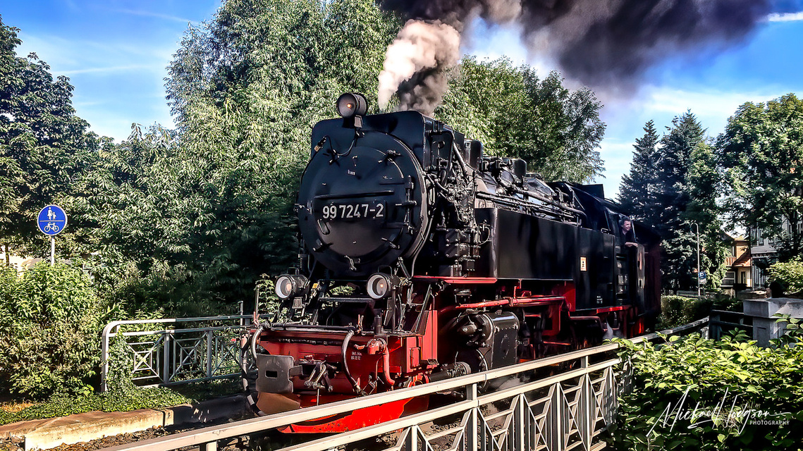 A narrow-gauge steam engine crosses a bridge on the Harz Mountain Railway in Germany’s Harz Mountains. 