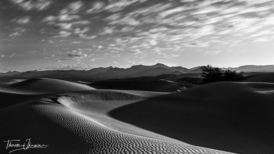 A black and white photo of beautiful dunes in Death Valley.