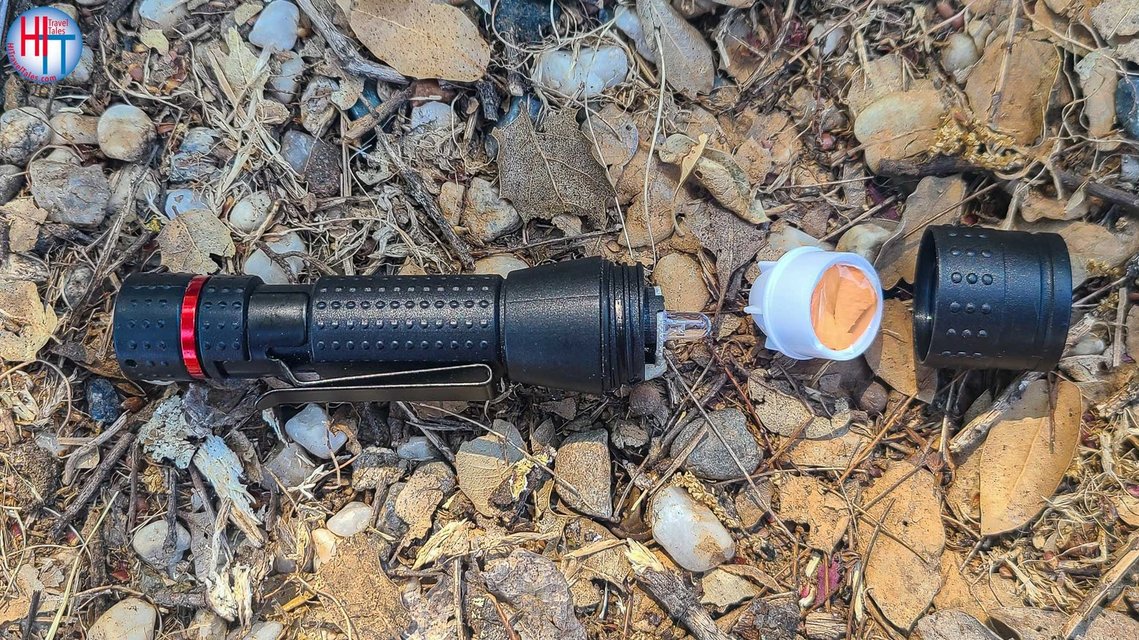 Image of a flashlight with gel to reduce glare during night photography