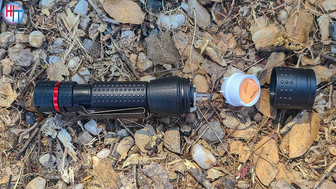 Image of a flashlight with gel to reduce glare during night photography