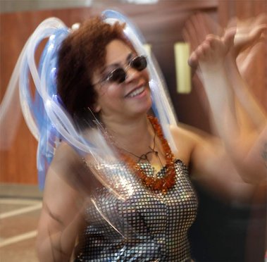 Photo Credit: D. Vegas Love. Valérie d. Walker in performance as V. (time-travelling story-collector-griot from the future). Encuentro IX, 2014. Montréal, Quebec. 