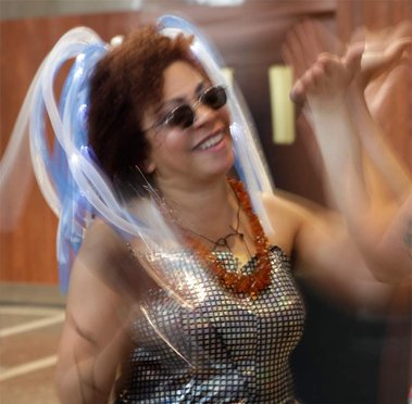 Photo Credit: D. Vegas Love. Valérie d. Walker in performance as V. (time-travelling story-collector-griot from the future). Encuentro IX, 2014. Montréal, Quebec. 