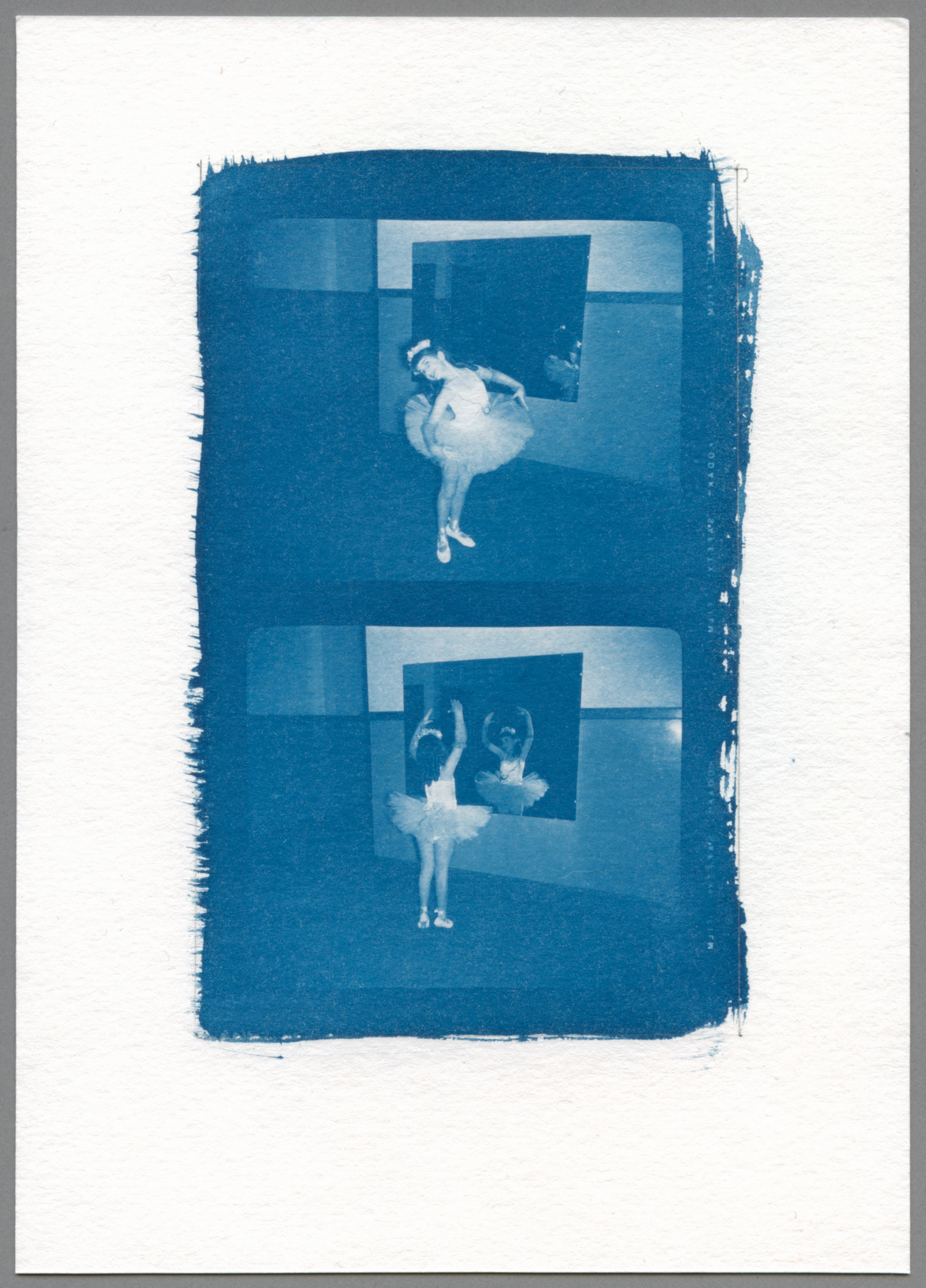 cyanotype of a little girl in a tutu posing as a ballerina in front of a mirror
