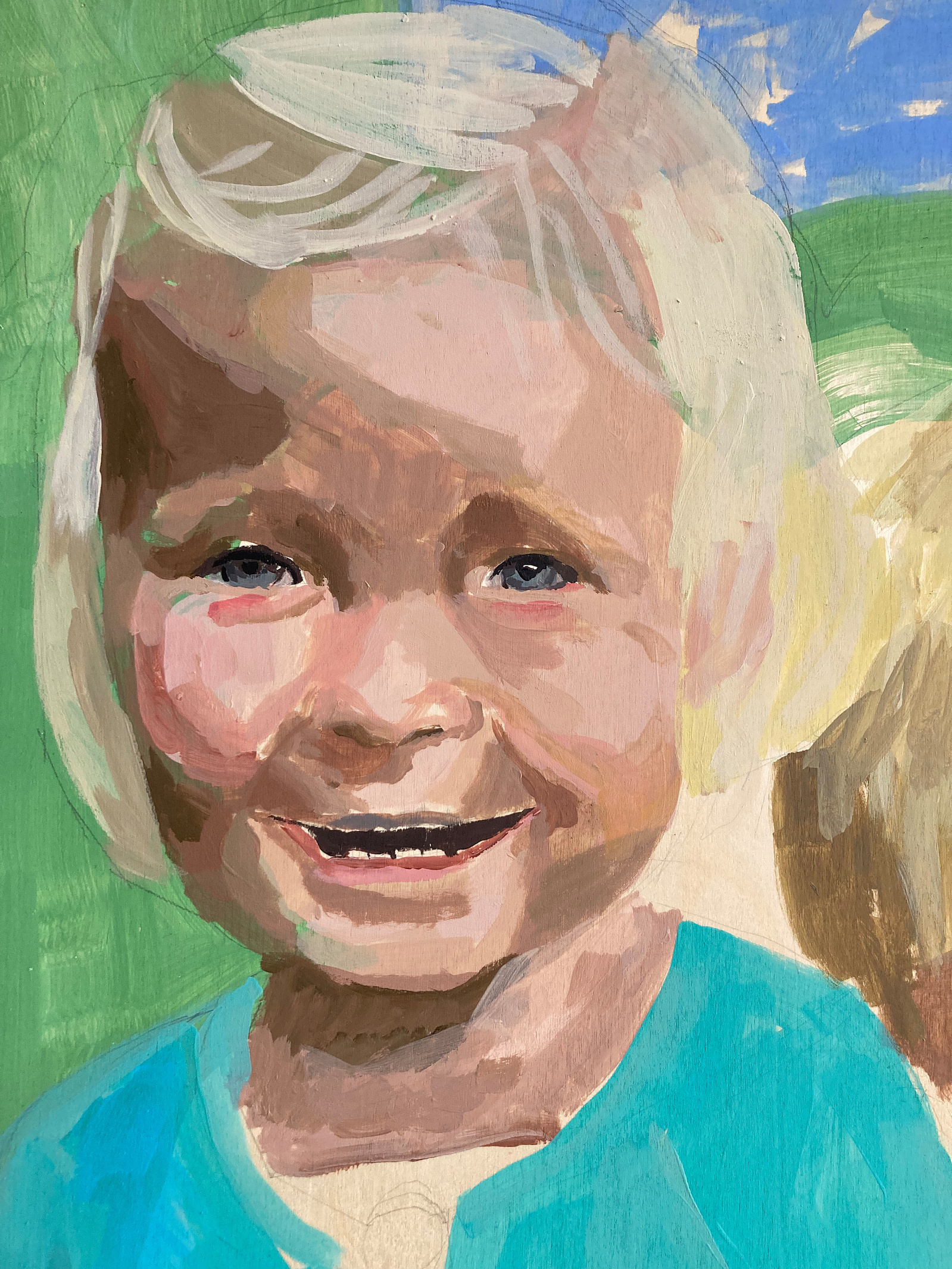 A close-up photograph of a painted portrait which is still in process. It depicts a young blonde child in a blue cardigan. The painting is made by the female British artist Mary Naylor in her Scarborough Studio