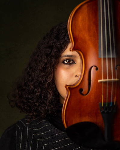 Creative portrait of a lady and her violin in a vintage style