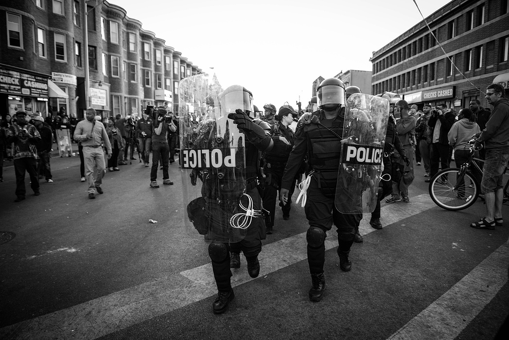 Riot Police charge towards a crowd of peaceful protestors on Pennsylvania and North Avenues in Baltimore.