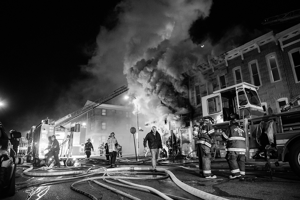 A storefront fire on Baker st. during a night of looting and rioting in Baltimore.