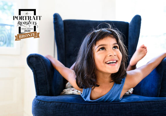 Bronze Merit in the Children's category of the Portrait Masters competition 2020 for this smiling portrait of a magical young Indian girl.