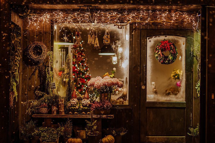 A tasteful, colourful, cosy mountain inspired Christmas chalet shop window, serving as a composite for your seasonal winter family portrait. I take your portraits in my studio, you choose the composite you love most.