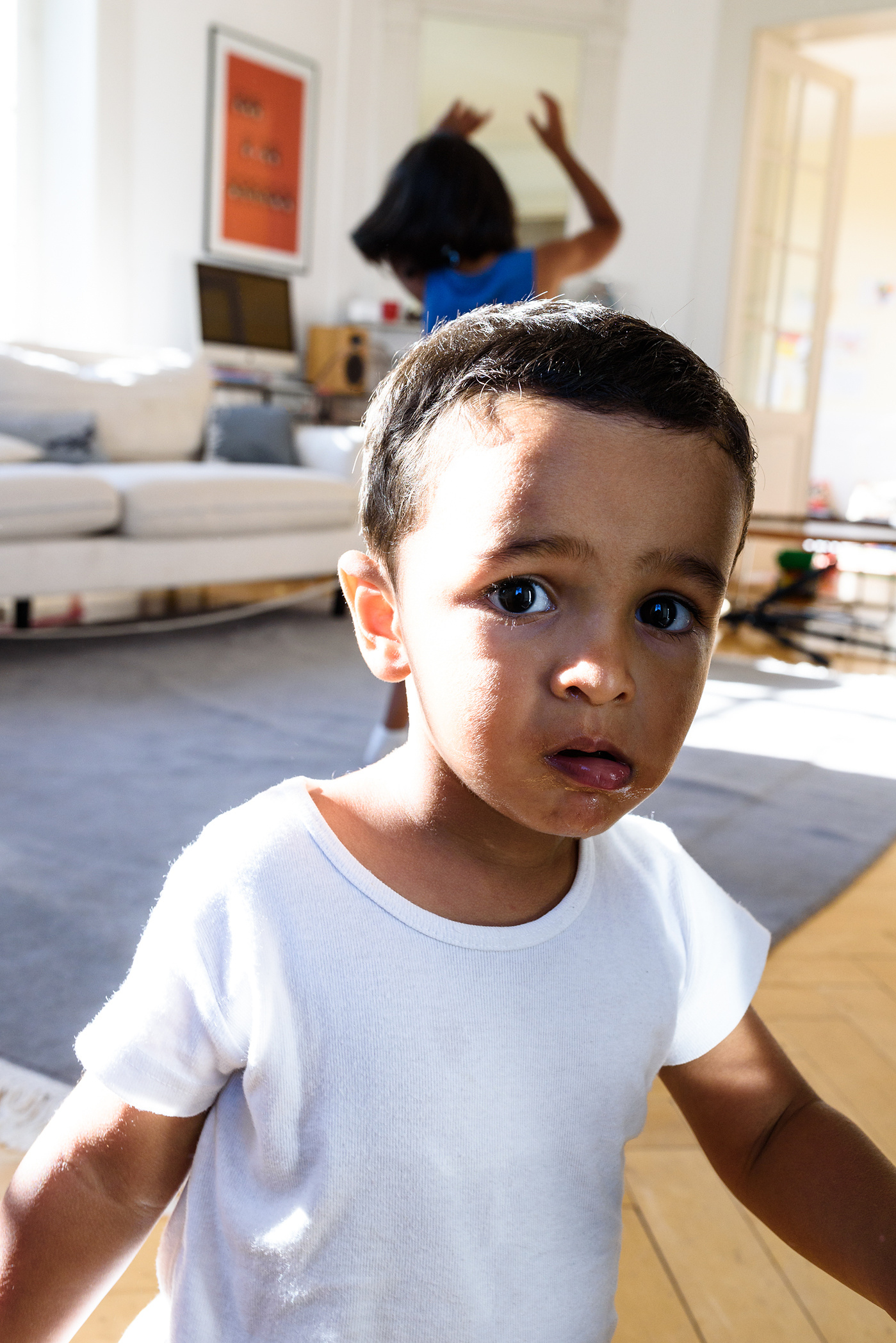 Close-up portrait of young boy taken during a lifestyle portrait session at the client's home in Geneva.