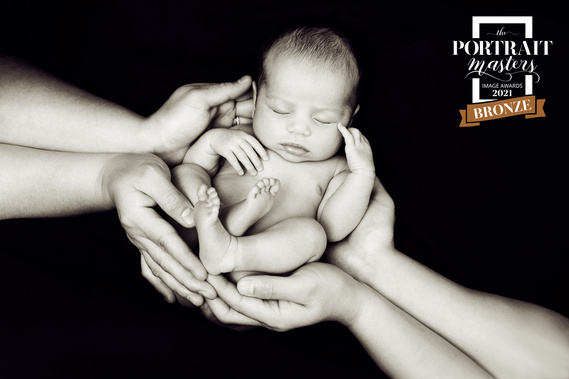 Bronze merit for this 'In parent's hands' black and white image in the Newborn section of The Portrait Masters' Competition January 2021