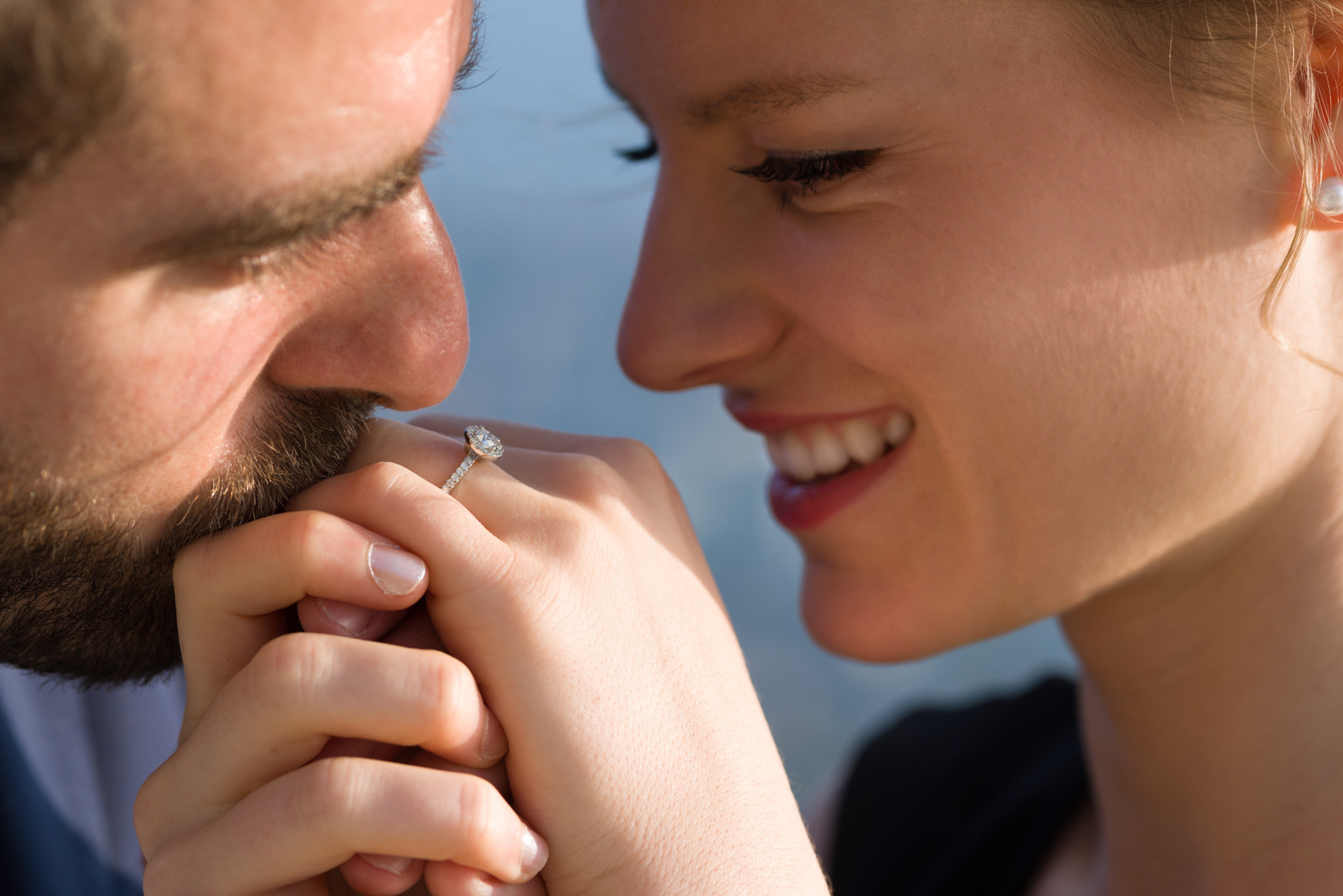 Close-up engagement photo showing the couples happiness and of course, the ring!