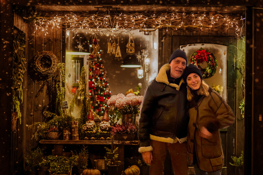 A tasteful, colourful, cosy mountain inspired Christmas chalet shop window, serving as a composite for your seasonal winter family portrait. I take your portraits in my studio, you choose the composite you love most.