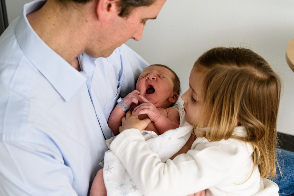 This photo was taken in the maternity the day after the baby was born with the family by Helen Putsman. Maternity, Newborn and Baby photography Packages can be found on this page.