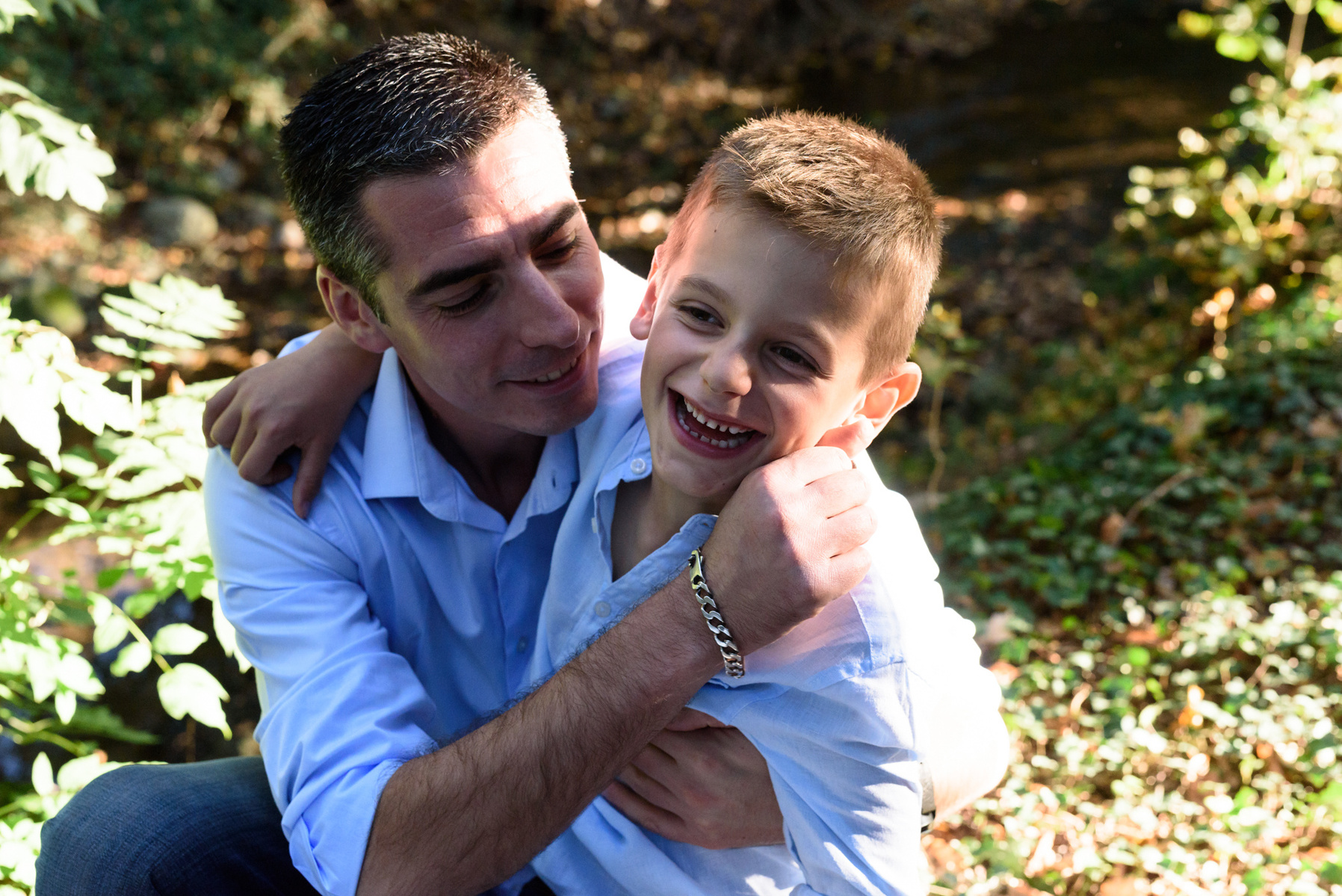 Father and son natural lifestyle portrait taken at the Seymaz behind my home-studio in Chêne-Bougeries, Geneva.