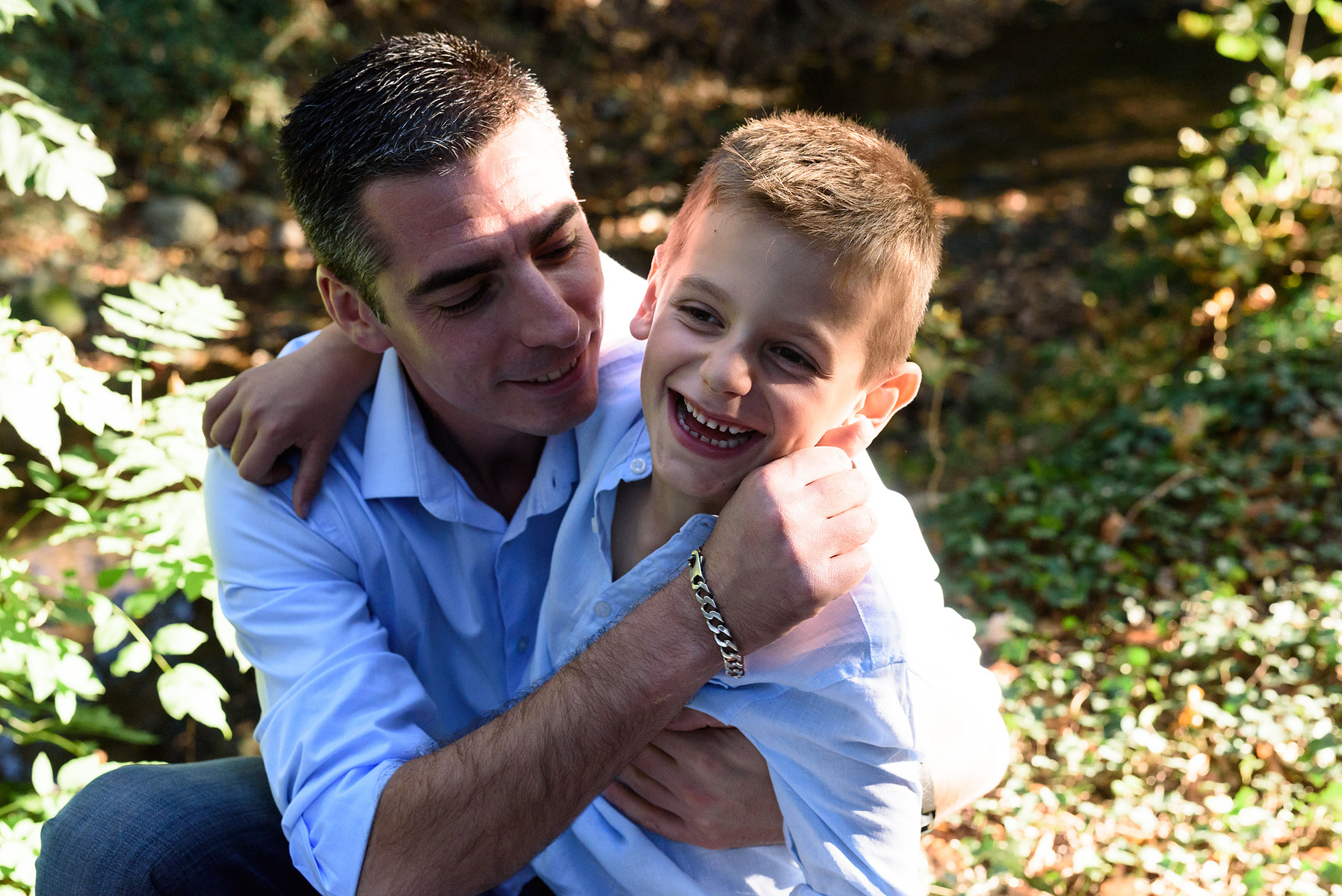 Father and son natural lifestyle portrait taken at the Seymaz behind my home-studio in Chêne-Bougeries, Geneva.