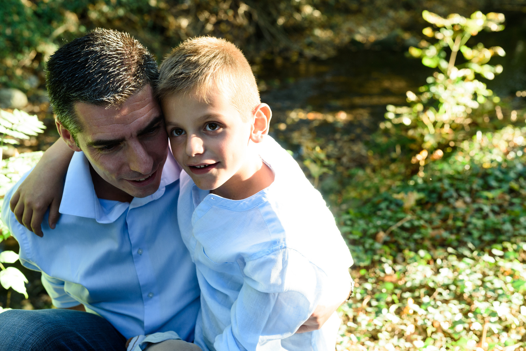 Father and son, natural lifestyle portrait taken at the Seymaz behind my home-studio in Chêne-Bougeries, Geneva.