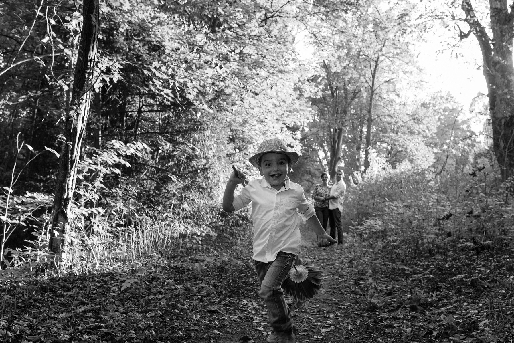 Two brother run in the wild, taken during a family lifestyle portrait portrait taken at the Seymaz behind my home-studio in Chêne-Bougeries, Geneva.