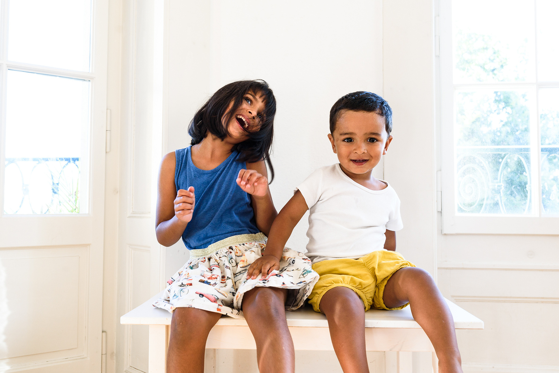 Brother and sister enjoy their own company during a lifestyle shoot shot at the client's home in Geneva.