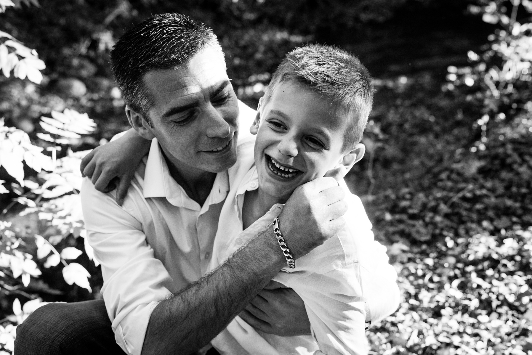 Father and son, natural lifestyle portrait taken at the Seymaz behind my home-studio in Chêne-Bougeries, Geneva.