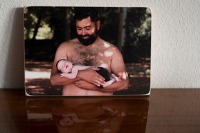 Here you see a photo of a father with his newborn baby printed onto a Photoblock, they are great for people who love nature and wood.