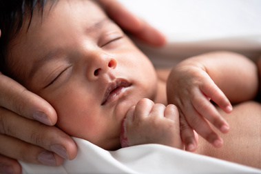 Words of thanks to me as a portrait photographer from the mother who is holding her newborn baby's face in her hands for a natural lifestyle airy photo shoot in Geneva. Review of Helen Putsman's newborn work.