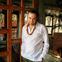 A self portrait of Andrew Adams wearing a welcome floral garland, on his first visit to India. 