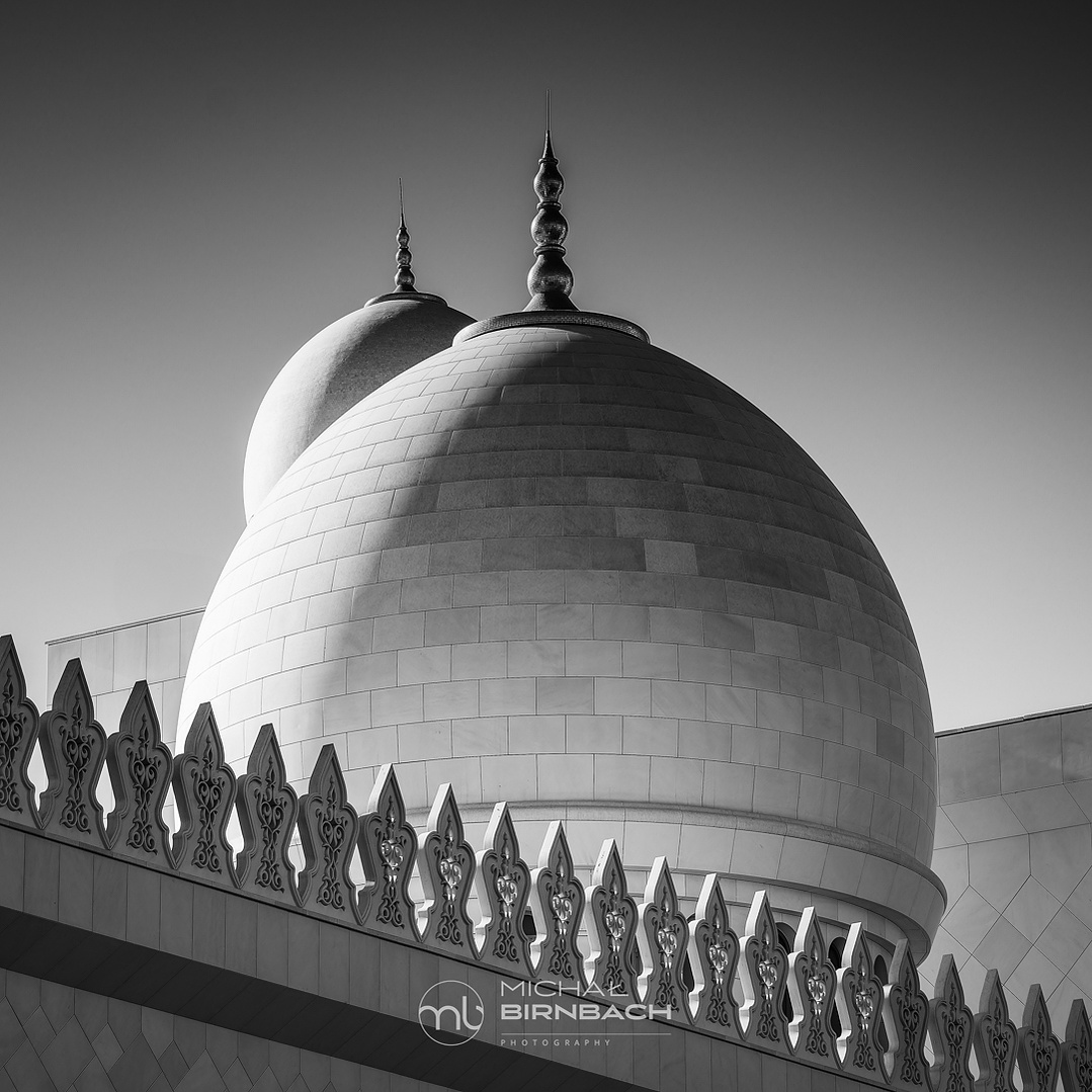 Sheikh Zayed Grand Mosque is one of  top travel landmarks in Abu Dhabi. This is a beautiful black and white photography shot inside the mosque. Amazing arabic architecture domes. 