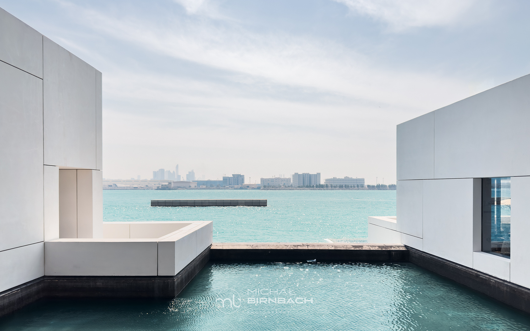 Louvre Abu Dhabi architecture photography. Amazing combination of the architecture minimalism and emerald water of the bay.