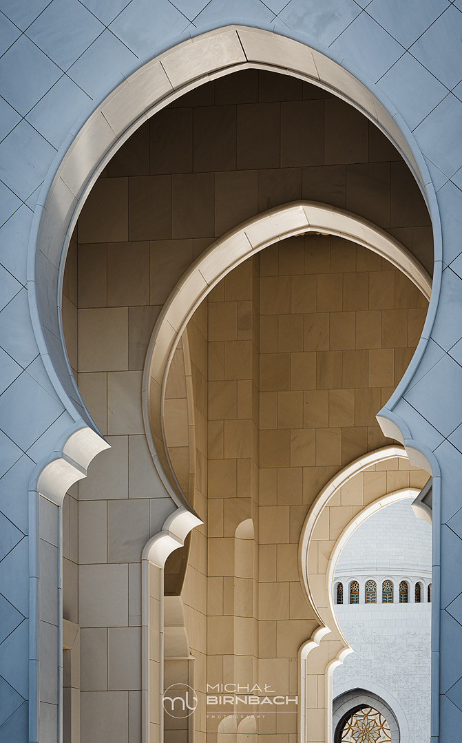 Sheikh Zayed Grand Mosque is one of  top travel landmarks in Abu Dhabi. This is a beautiful black and white photography shot inside the mosque. Amazing arabic architecture arches. 