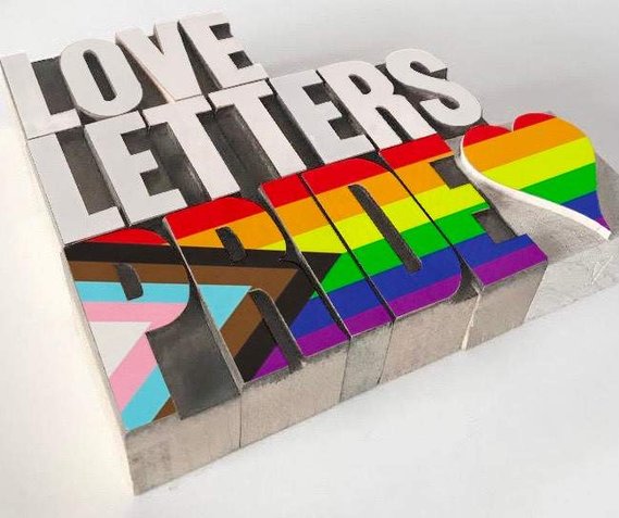 Love Letters Pride 2023 wooden type blocks, reversed so that it can be read normally.